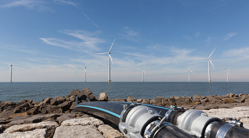 Offshore Wind Farm With Cables In The Foreground